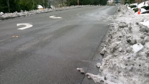 Sidewalk and driveway access occluded by snow