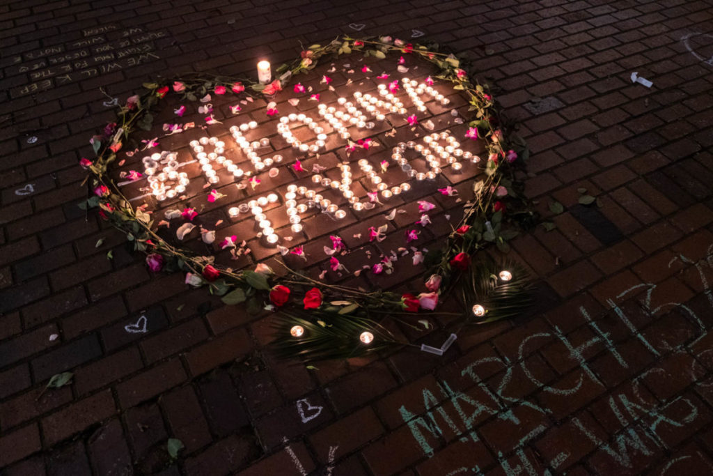 One year after Breonna Taylor’s murder, protestors took to the streets to decry her tragic death, lighting a vigil in Occidental Park before their march.