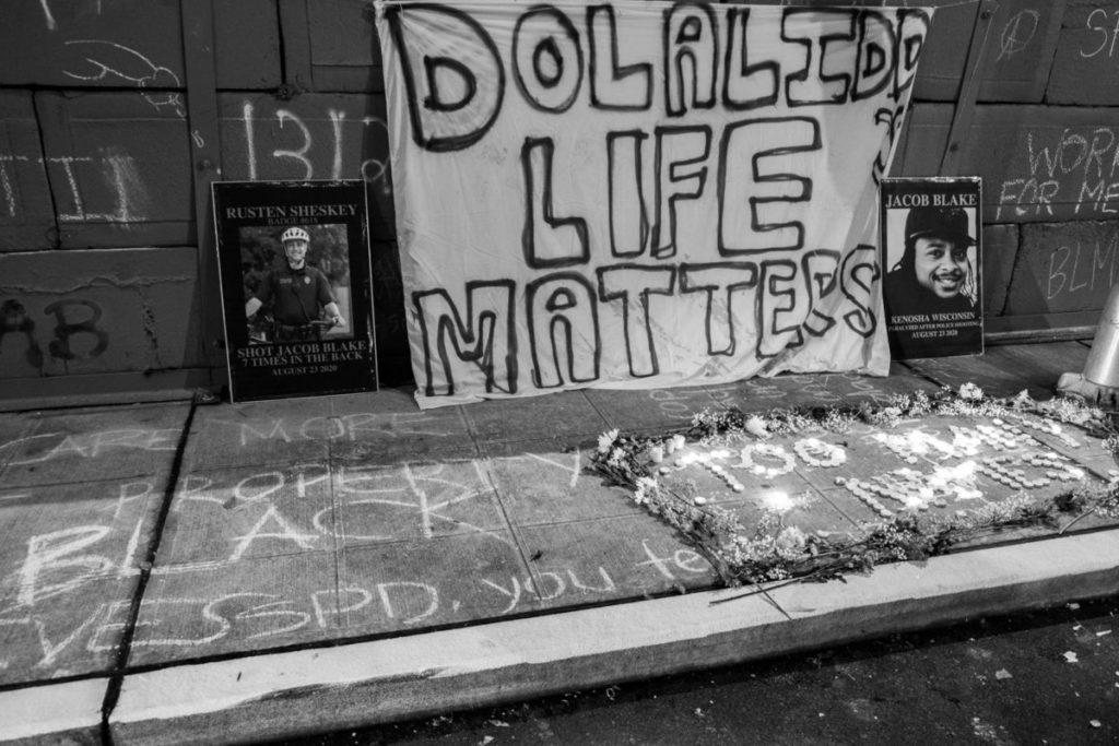 During a March 2021 march, protestors honored Jacob Blake - who was shot seven times and paralyzed from the waist down - in front of the West Precinct police station in Downtown Seattle.